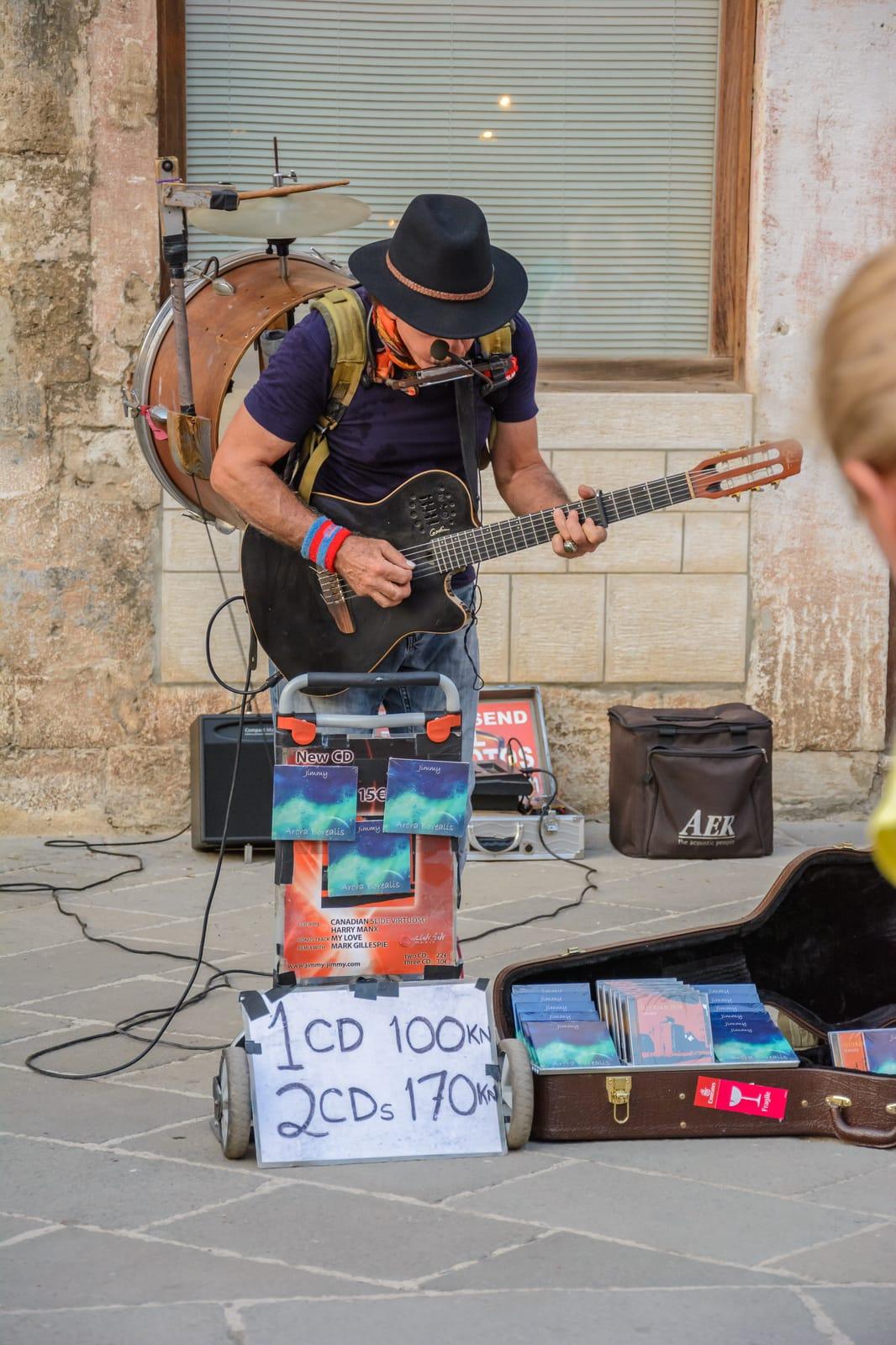 72501178_street-musicians-with-cd-sale